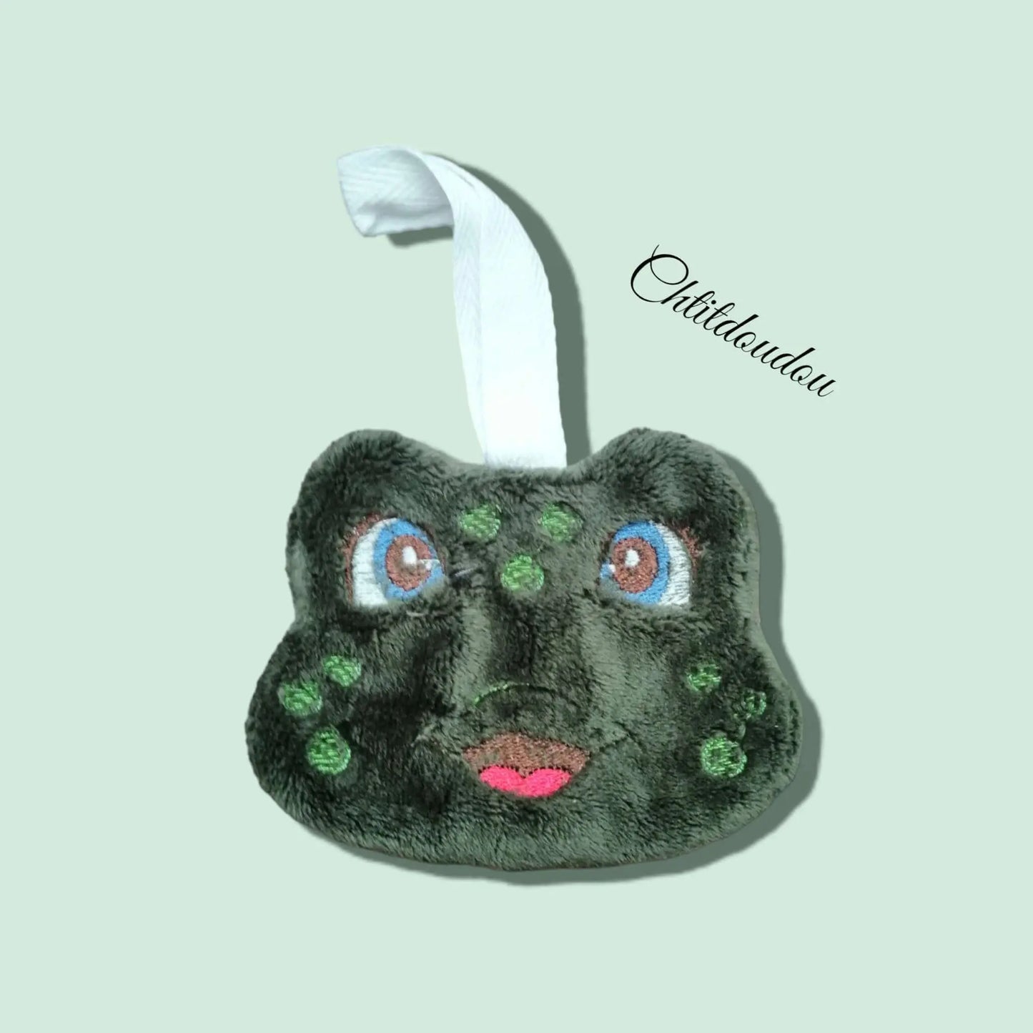 Attache tétine en forme de grenouille de couleur verte